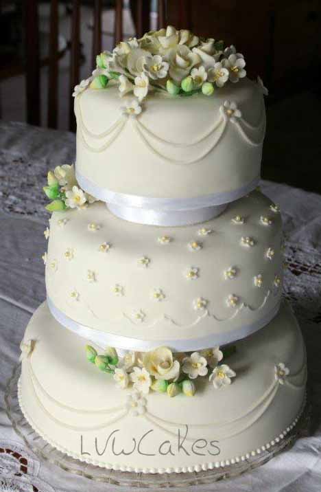 Three Tiers With Sugar Roses And Freesia